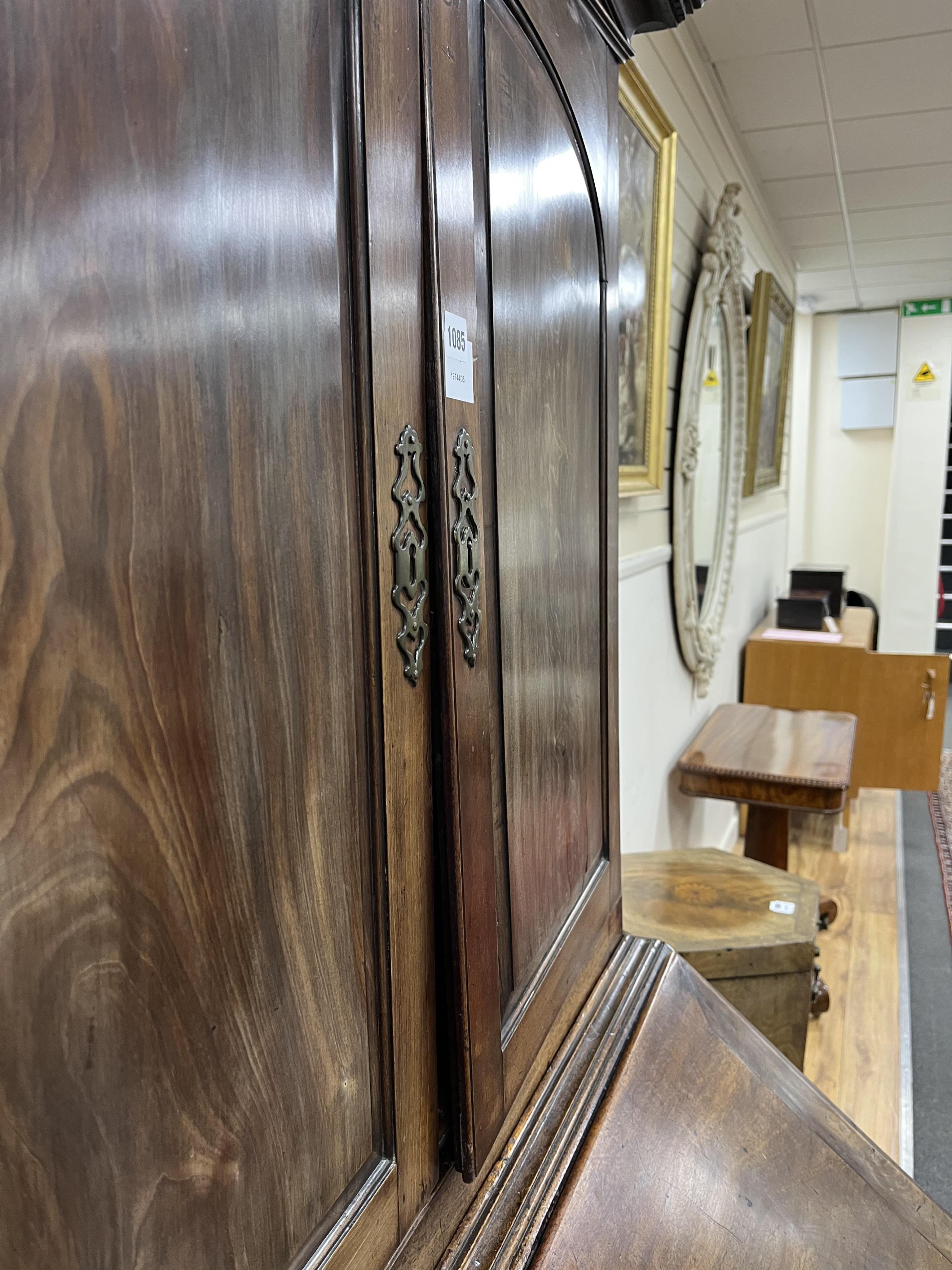 A small George III mahogany bureau cabinet with broken arch pediment, width 95cm, depth 62cm, height 198cm